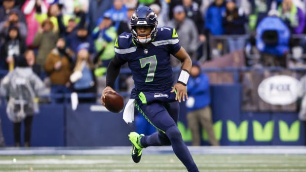 Jan 8, 2023; Seattle, Washington, USA; Seattle Seahawks quarterback Geno Smith (7) scrambles against the Los Angeles Rams during the fourth quarter at Lumen Field.